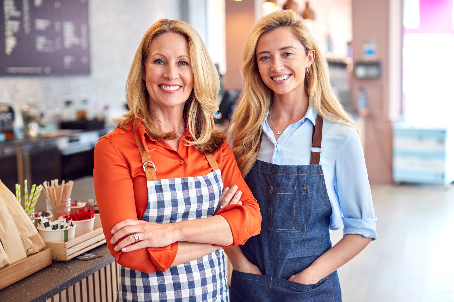 Portrait Of Female Owner And Staff Working In Coffee Shop Or Restaurant