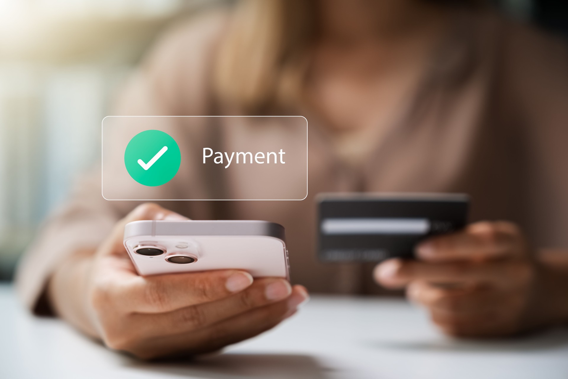 Female customers utilize smartphone for online payments via credit/debit cards and mobile payment